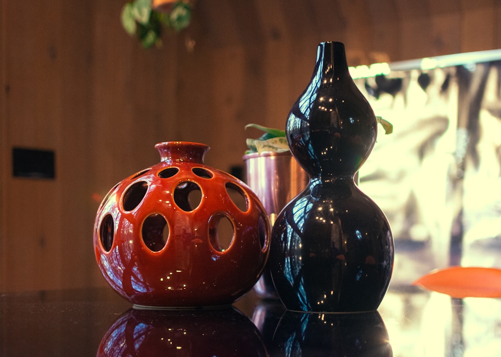 a couple of vases sitting on top of a table