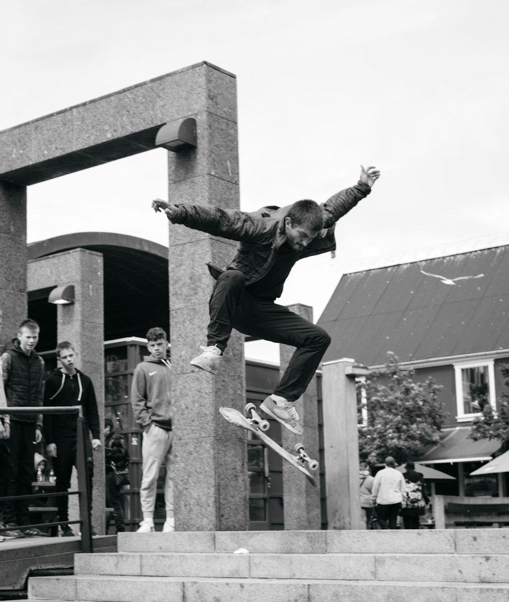 a man flying through the air while riding a skateboard