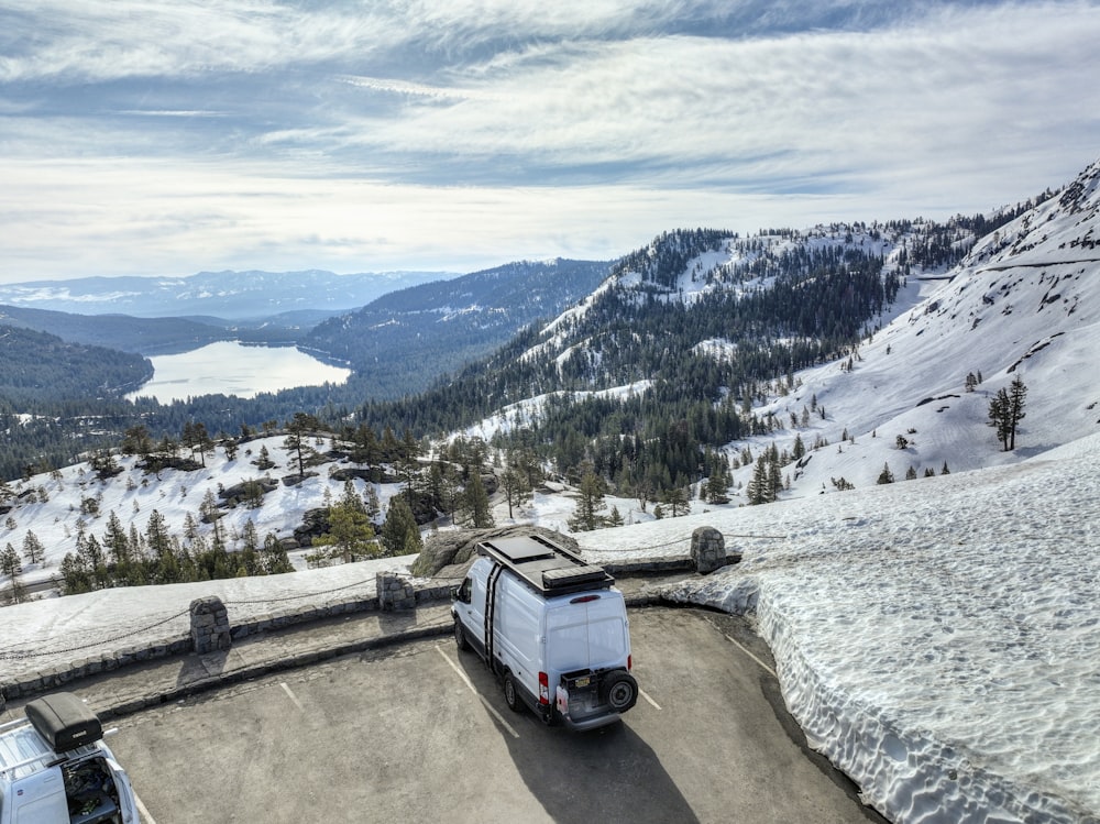 a van is parked on the side of a mountain