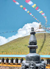 a view of a hill with many flags flying in the sky
