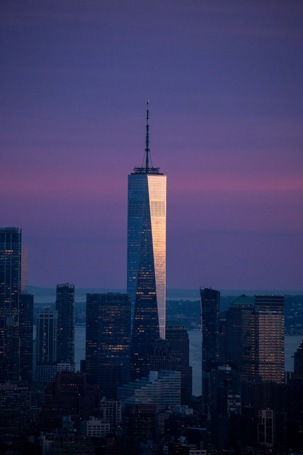 a very tall building in the middle of a city