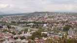 A scenic view of Tbilisi's old town with colorful buildings.