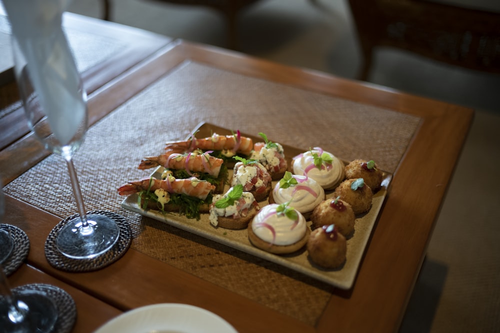 a wooden table topped with lots of food