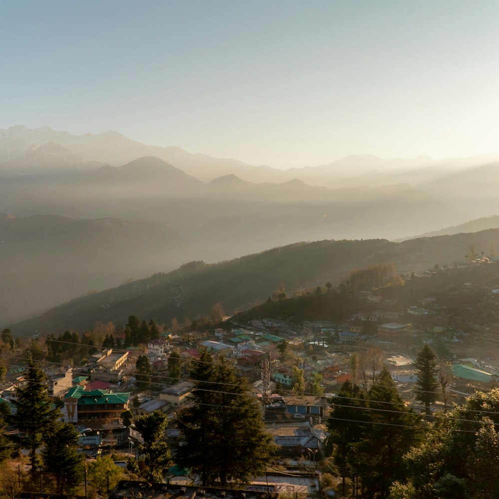 a view of a town with mountains in the background