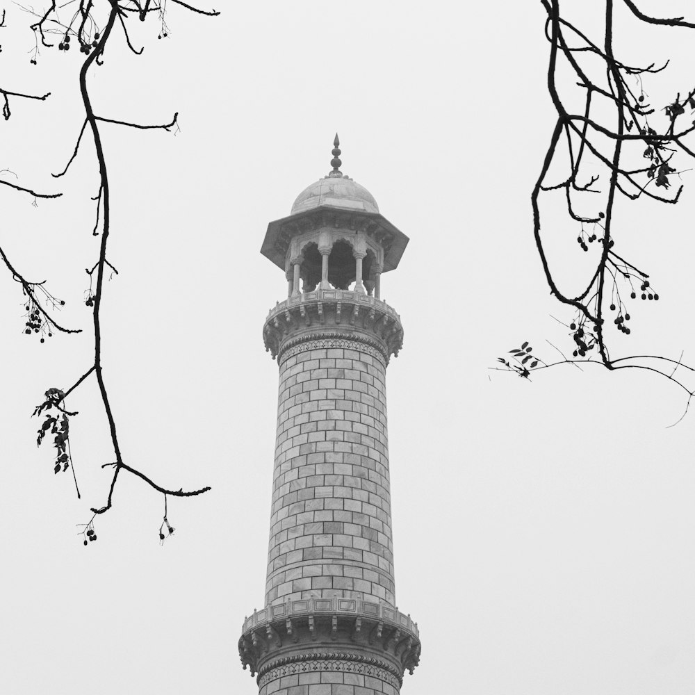 a black and white photo of a clock tower