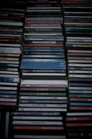 Stack of colorful CD cases arranged neatly in a grid layout