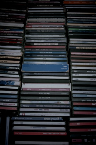 A collection of colorful minidiscs neatly arranged on a wooden table.