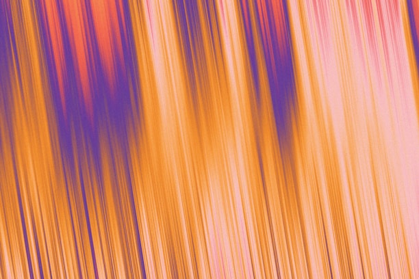 A vibrant abstract image with vertical streaks of color, including bright orange, purple, and pink, creating a sense of dynamic motion and energy.