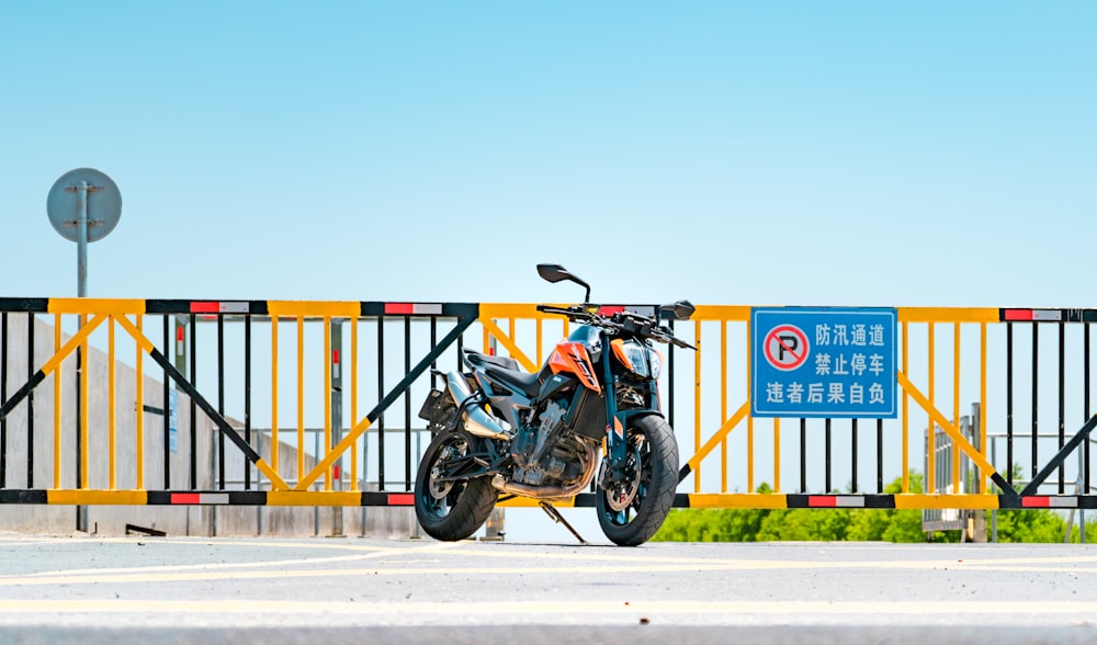 a motorcycle parked in front of a gate
