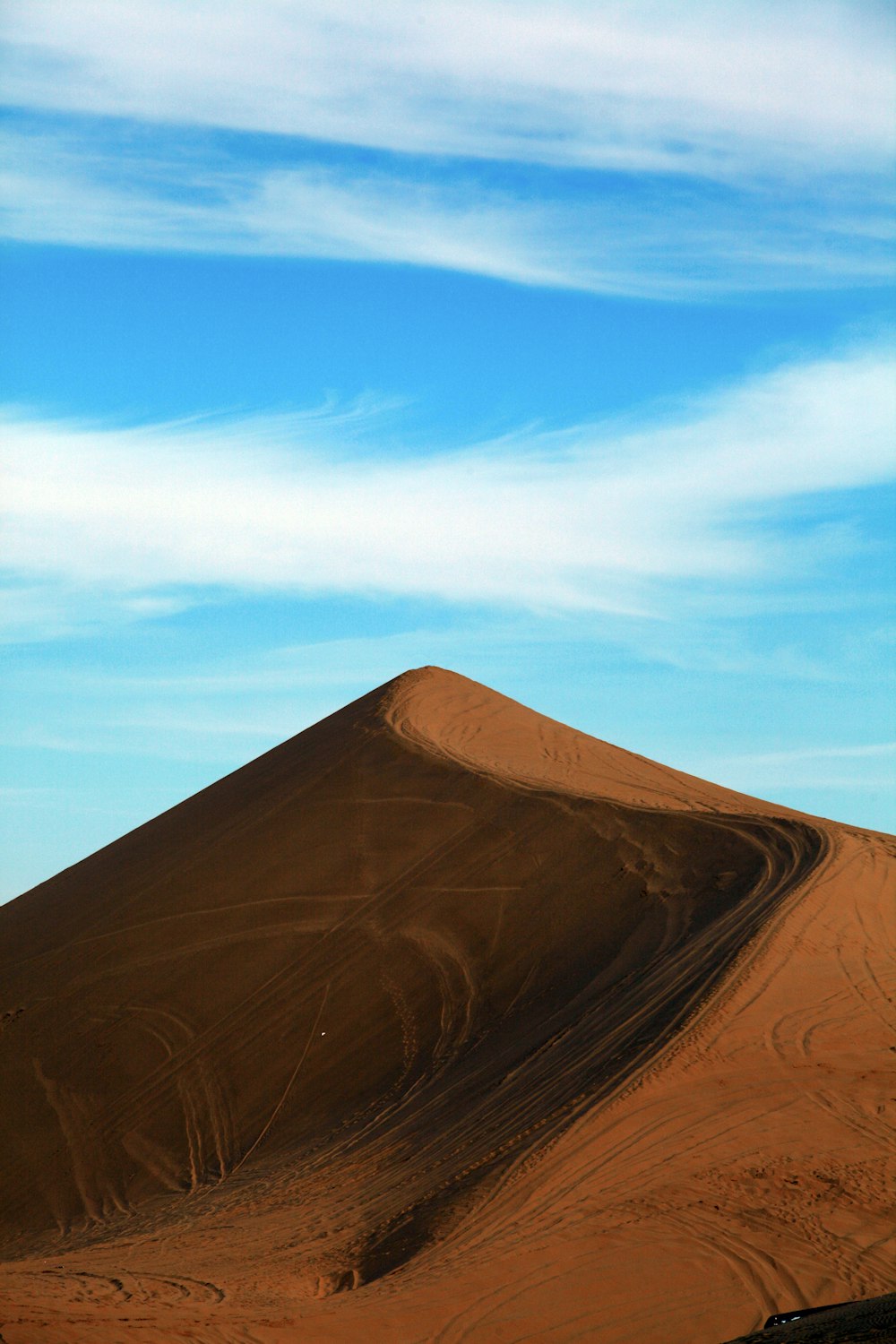 a large sand dune in the middle of a desert