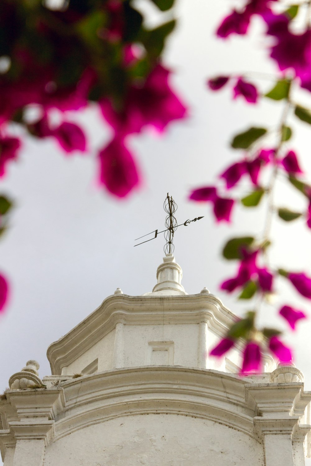 a building with a weather vane on top of it