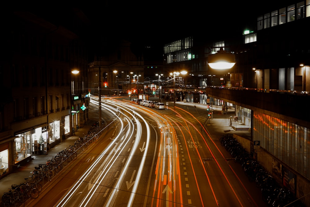 a city street filled with lots of traffic at night