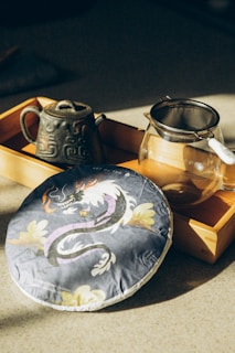 a tea pot and a tea tray on a table