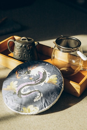 a tea pot and a tea tray on a table