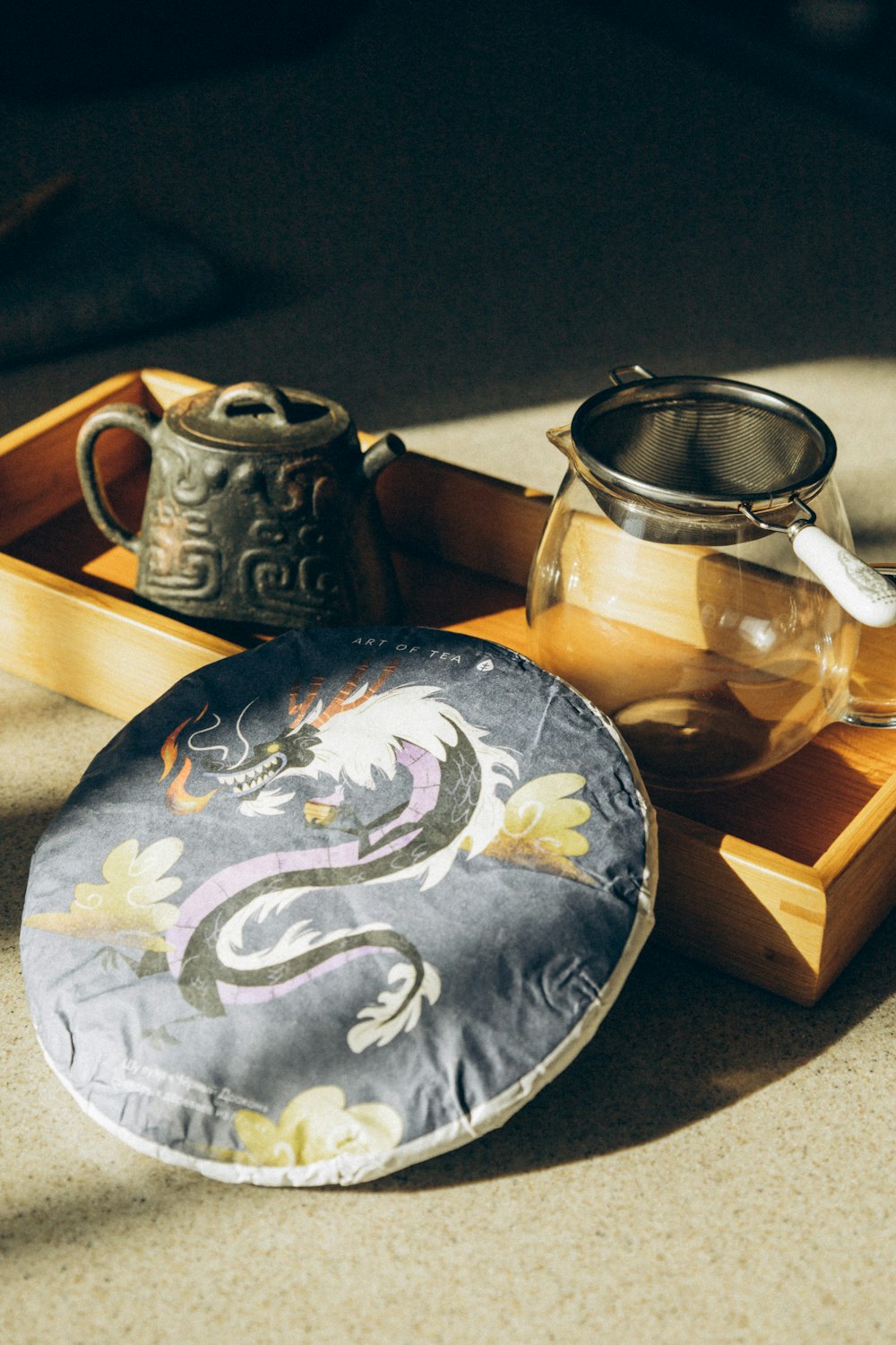 a tea pot and a tea tray on a table