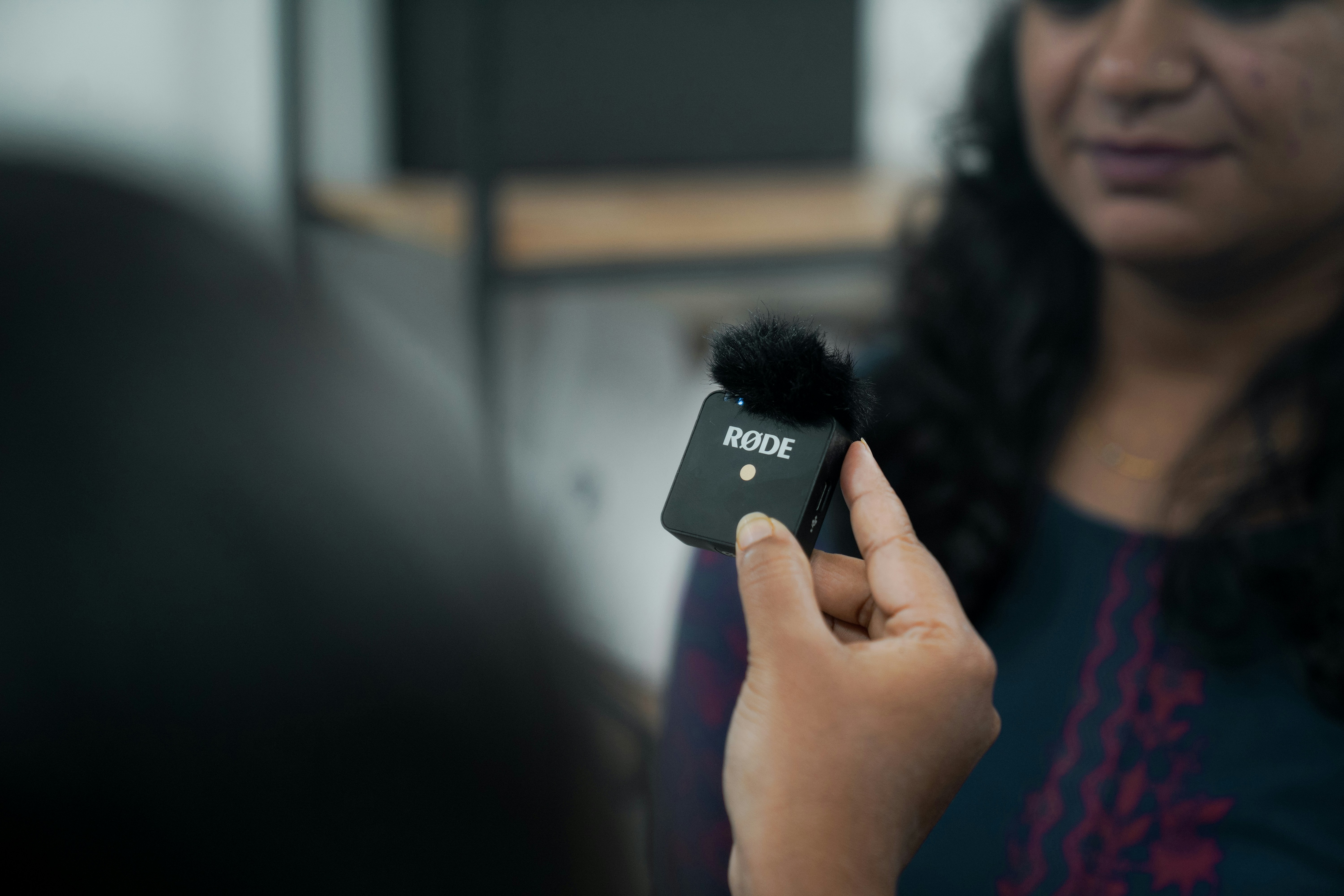 a woman is holding a pom pom in her hand