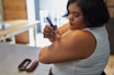 a person with an insulin injection pen