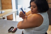 a person with an insulin injection pen