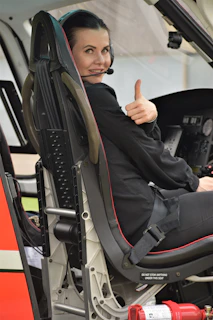 A pilot giving a thumbs-up inside the cockpit before takeoff
