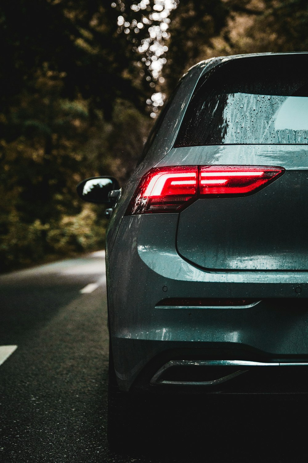 the back end of a car on a road