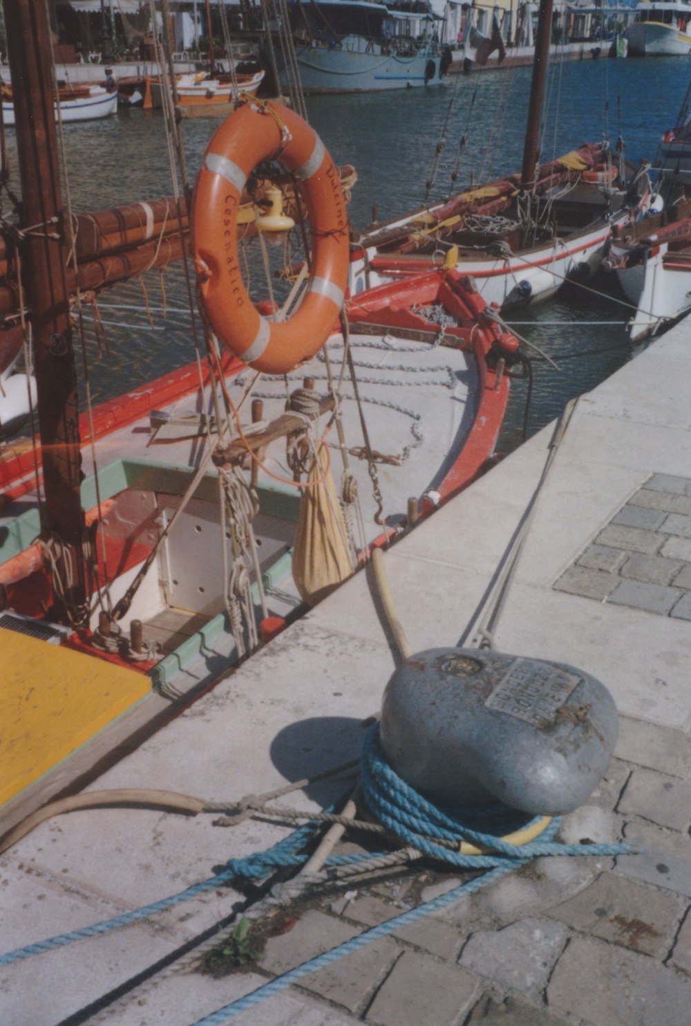 a boat with a life preserver on the dock