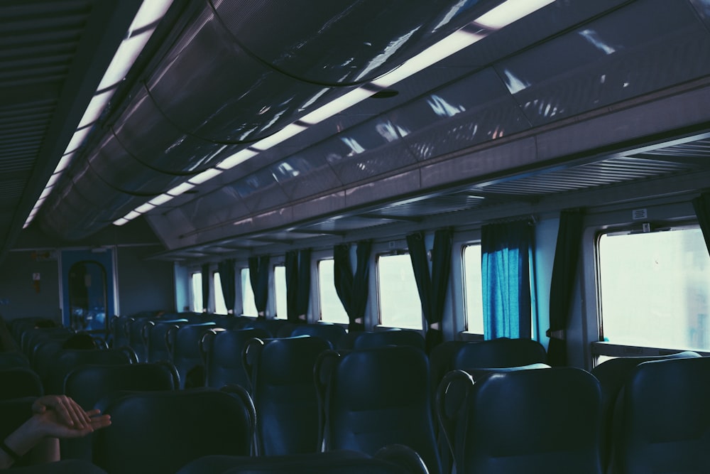 the inside of a train car with lots of seats