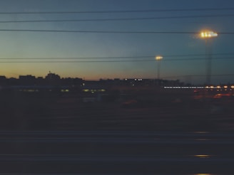 A cityscape at dusk with news headlines overlayed on the skyline.