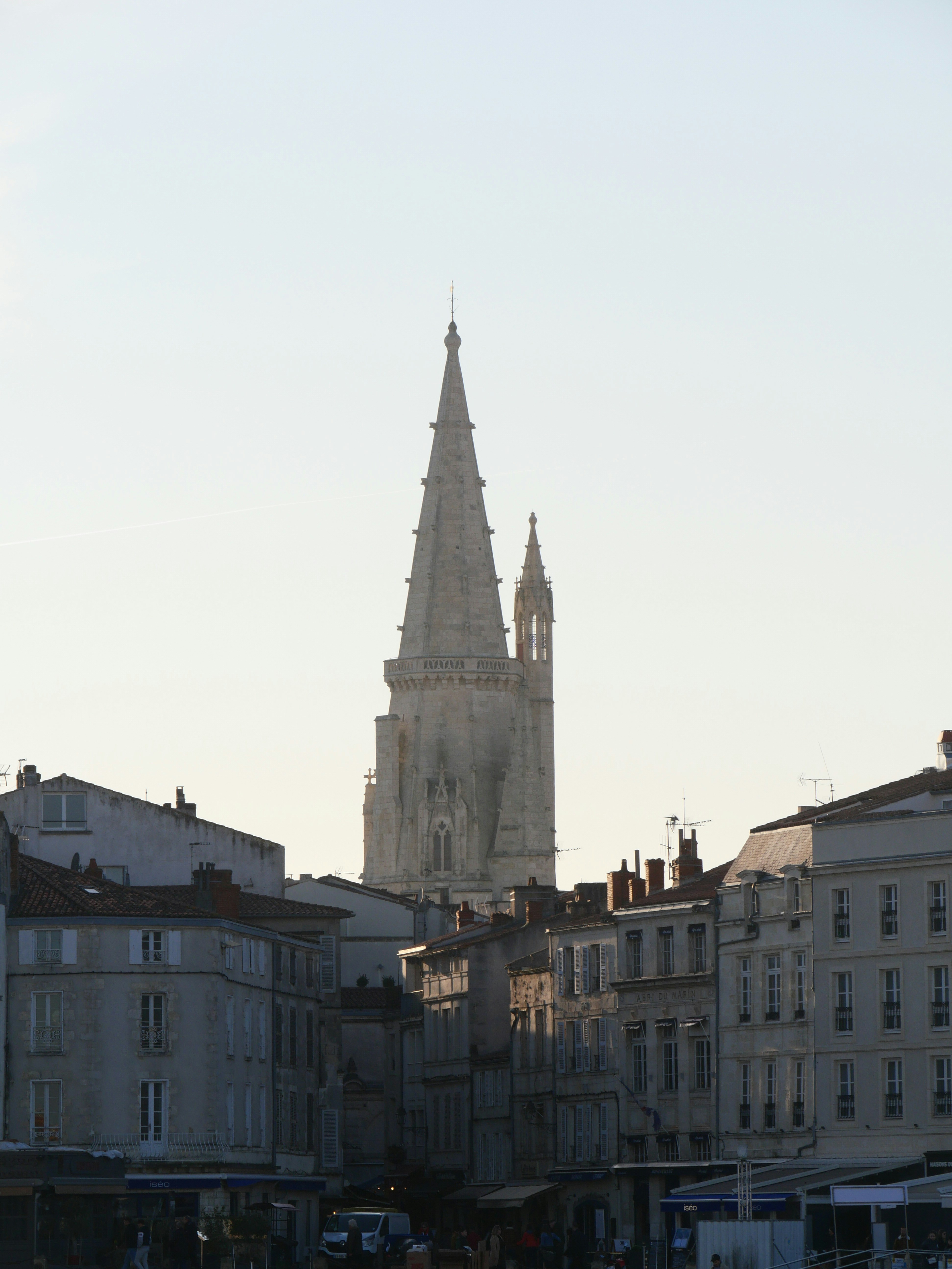 a large cathedral towering over a city filled with tall buildings