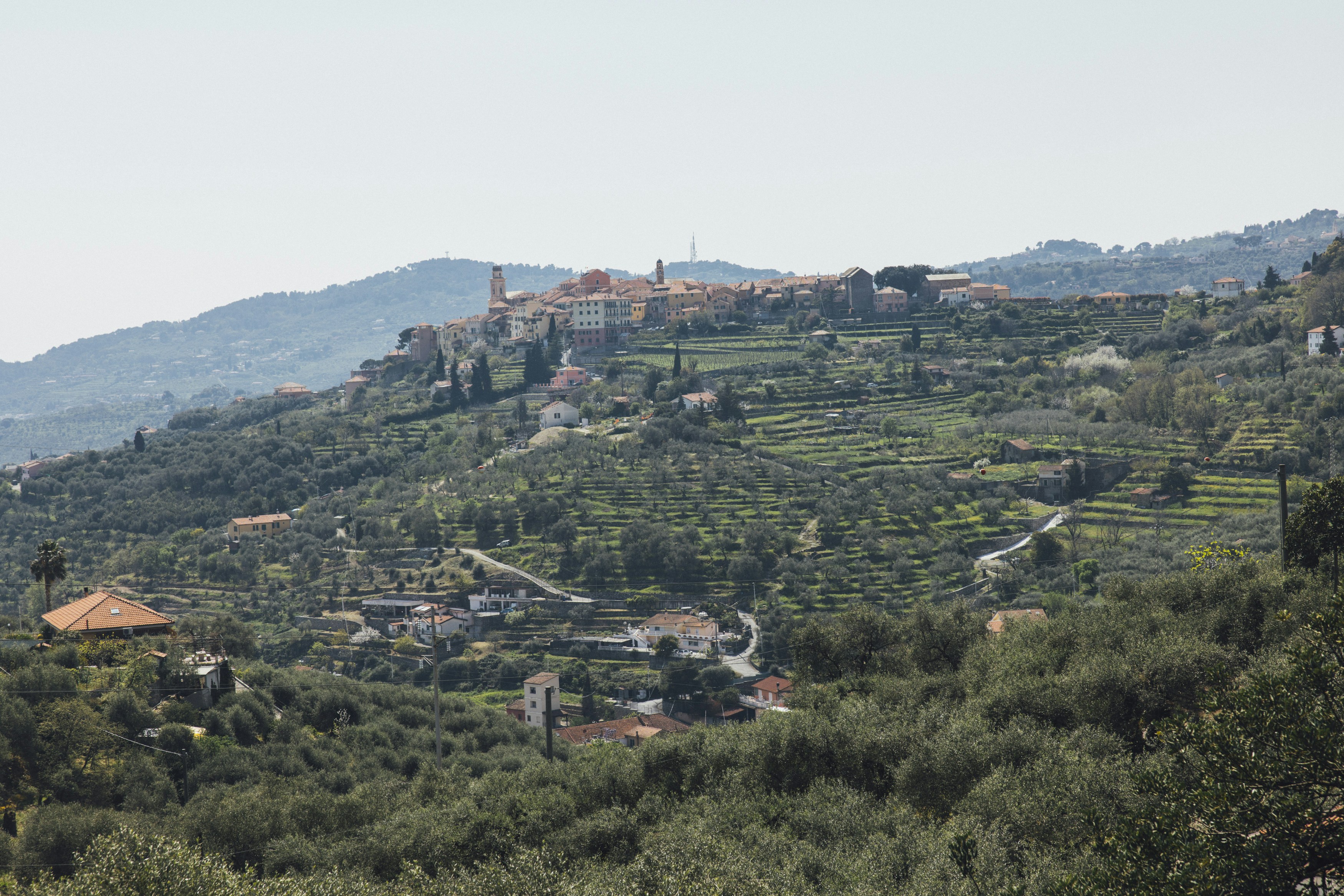 a hill with a village on top of it
