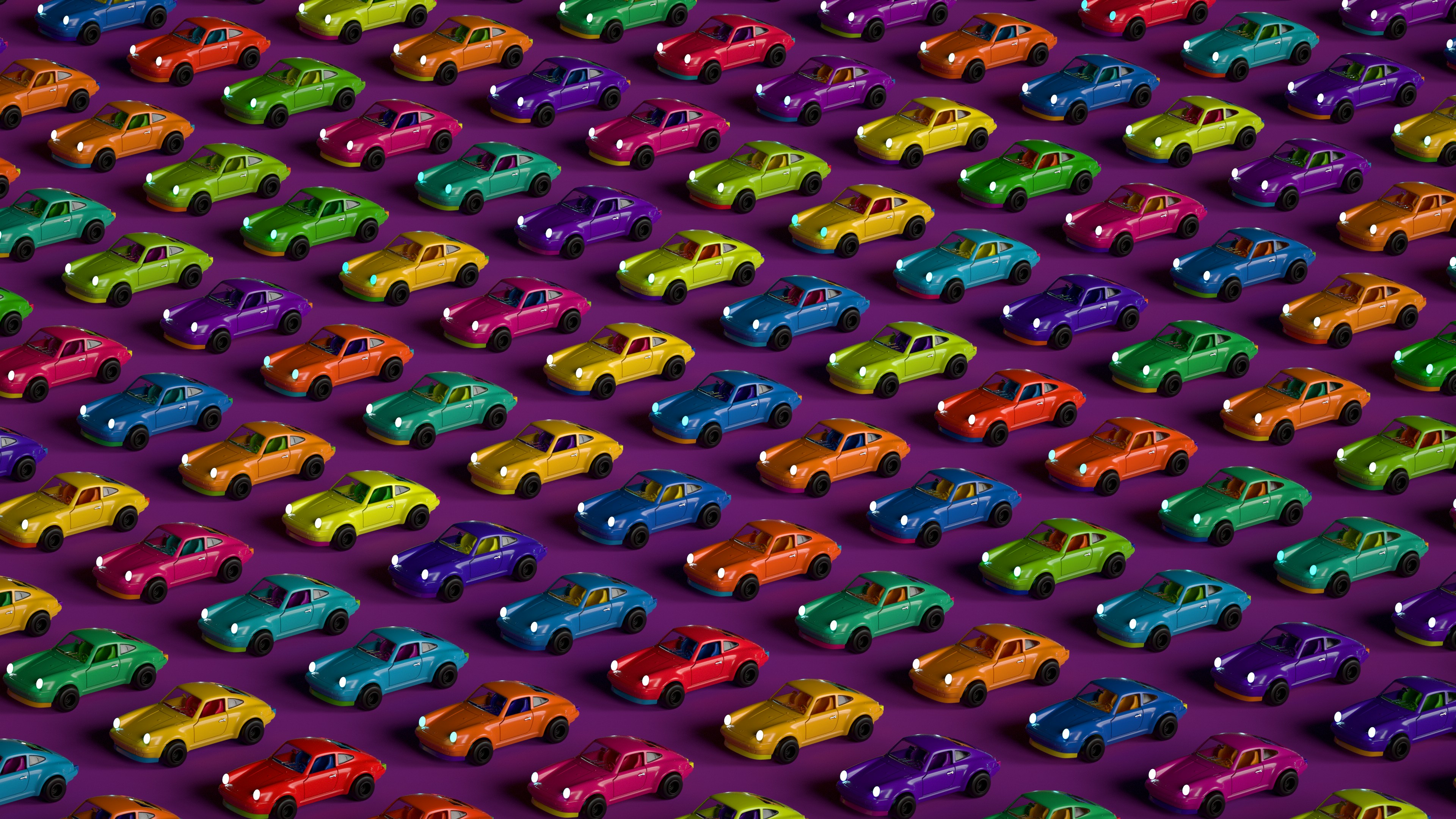 a large group of colorful toy cars on a purple background