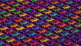 Rows of colorful toy cars arranged in a diagonal pattern on a purple background. Each car exhibits a unique hue, creating a visually striking and vibrant display. The cars are evenly spaced, showcasing an array of colors including red, green, blue, yellow, and purple.