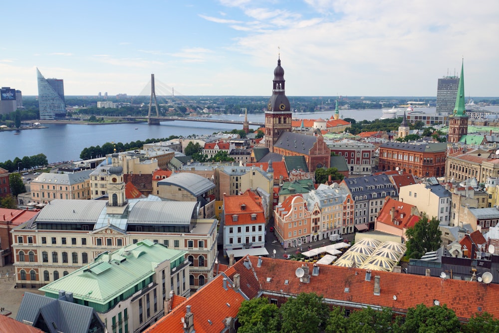 an aerial view of a city with a river in the background