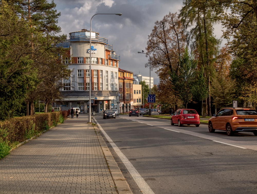 a city street with cars parked on the side of the road