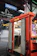 Photo of a rugged food truck being serviced inside a busy, well-equipped garage.