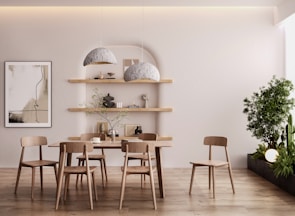Minimalist dining nook with a wooden table and ceramic pendant lights