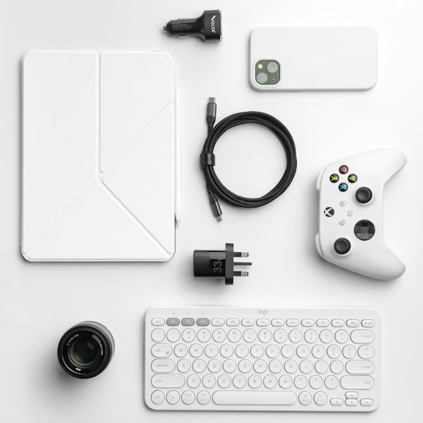 Computer keyboard and electronics on a desk