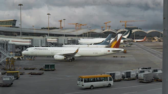 a couple of airplanes parked at an airport