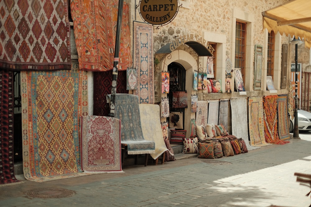 a store front with lots of rugs and rugs on display