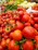 A vibrant photo of fresh vegetables neatly arranged in a wooden crate at a local market.