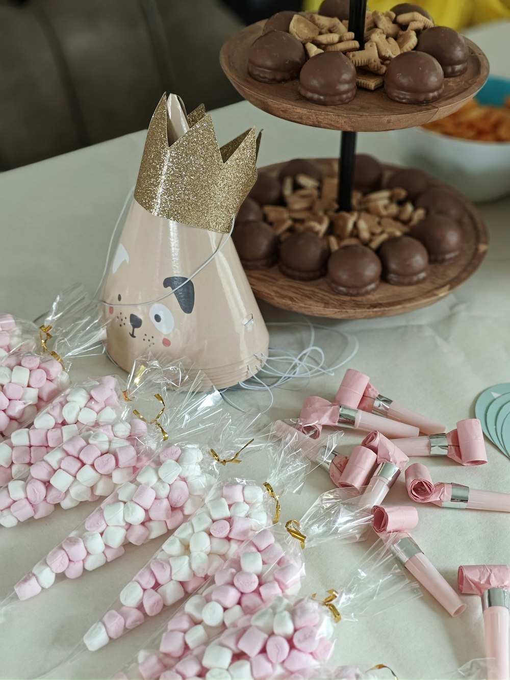 a table topped with lots of pink and white candies