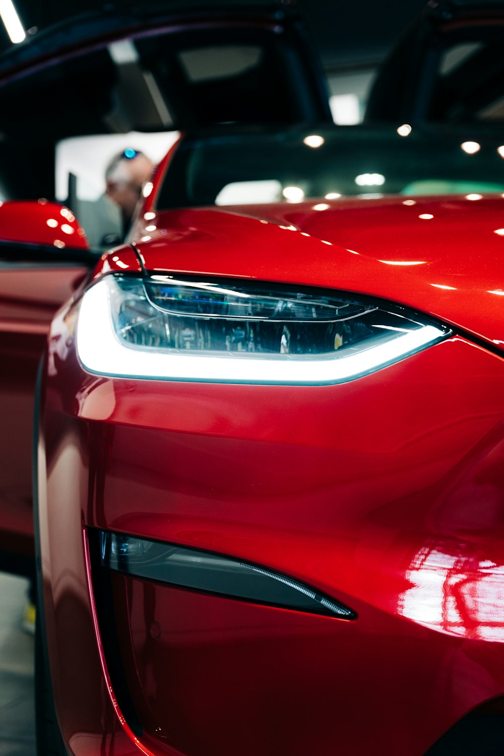 a close up of the front of a red car