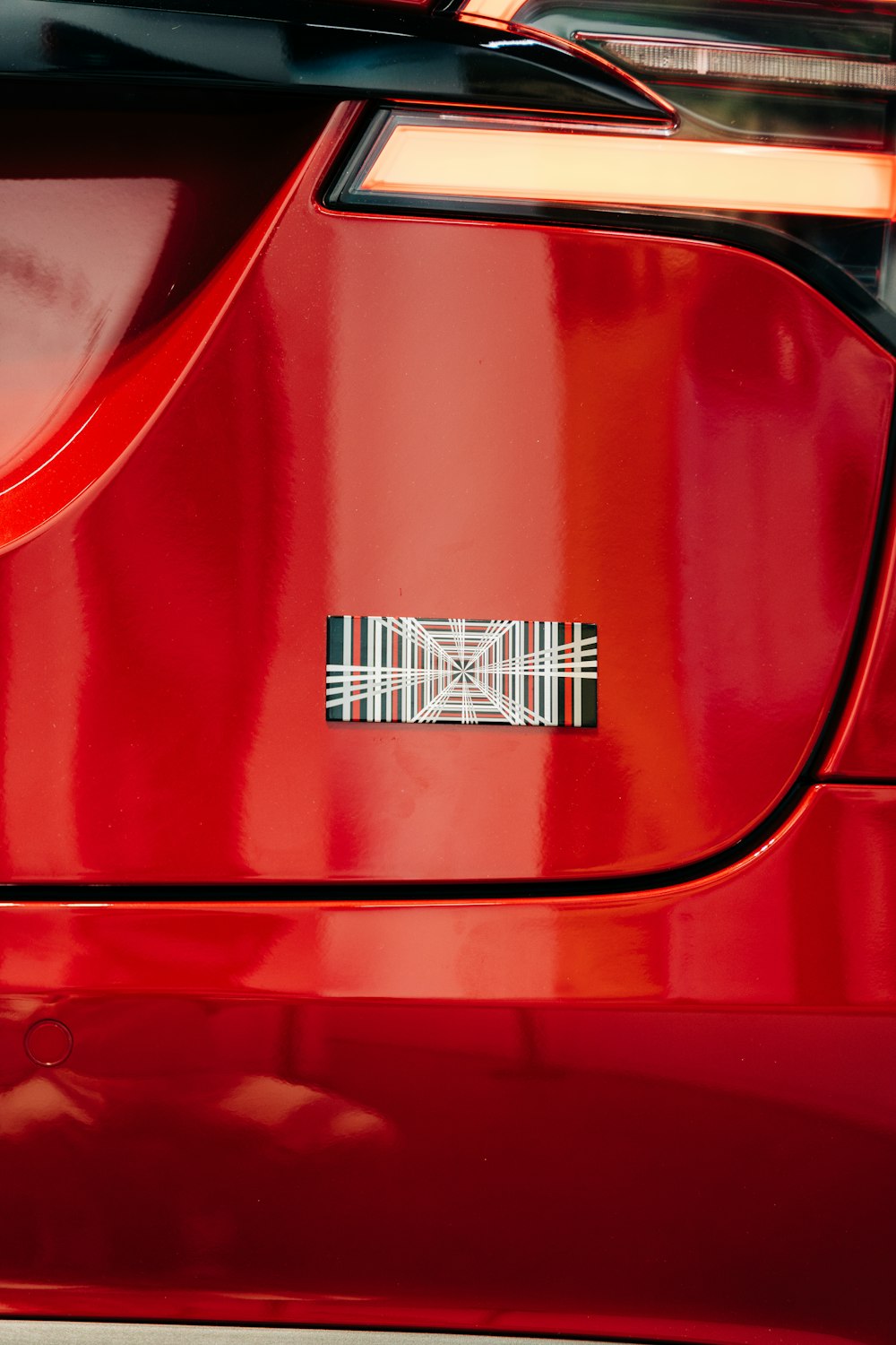 a close up of a red car's tail light