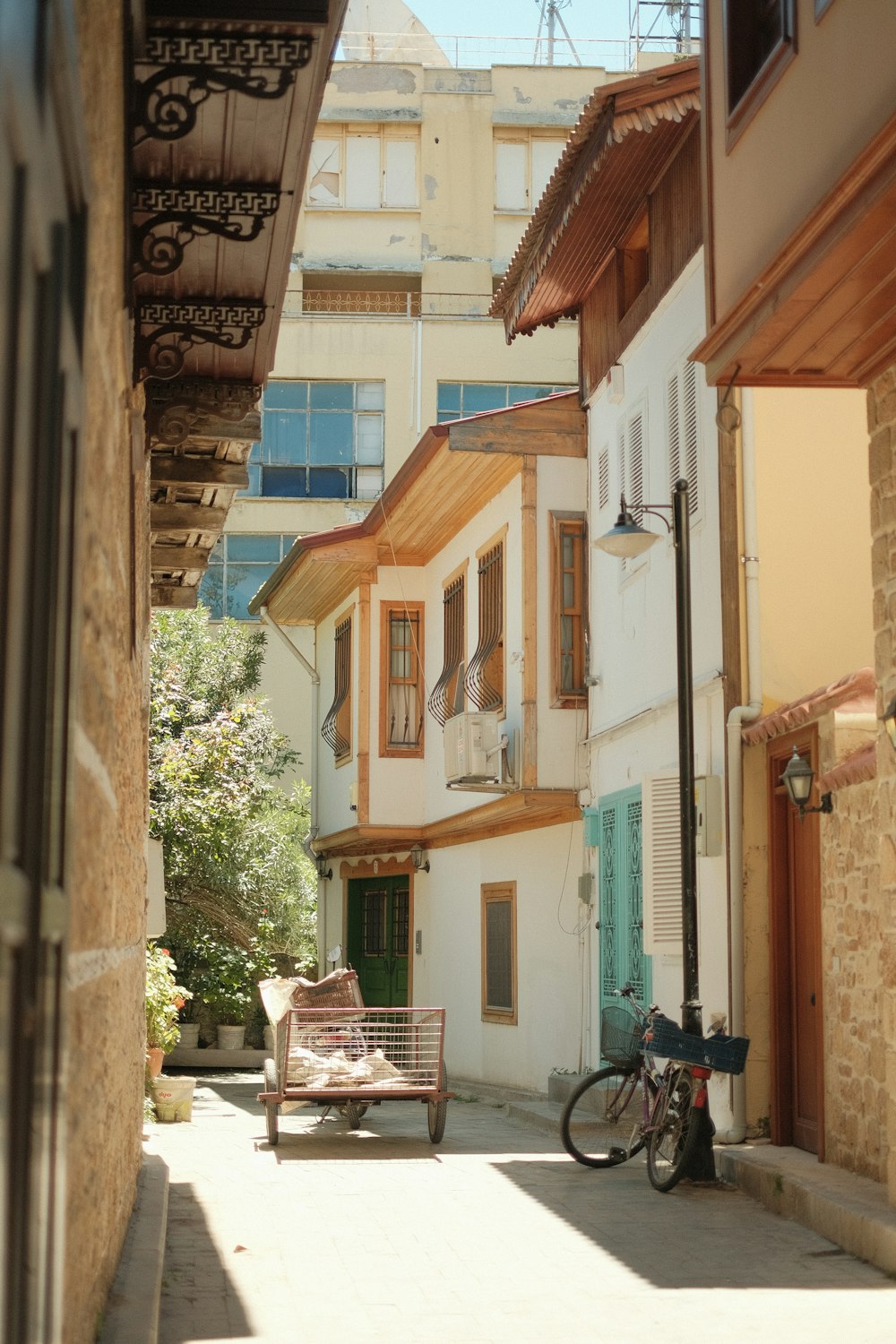 a bike parked on the side of a street next to a building