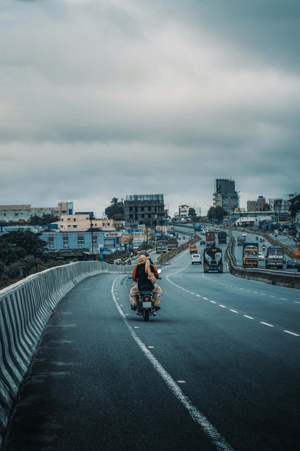 a person riding a motorcycle on a highway