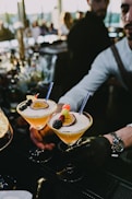 a couple of people that are holding some drinks