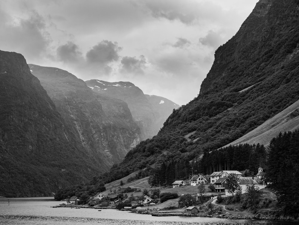 a black and white photo of a mountain village