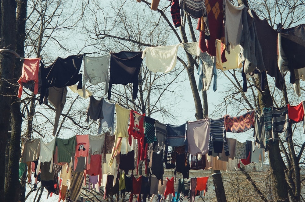 a bunch of clothes hanging on a clothes line