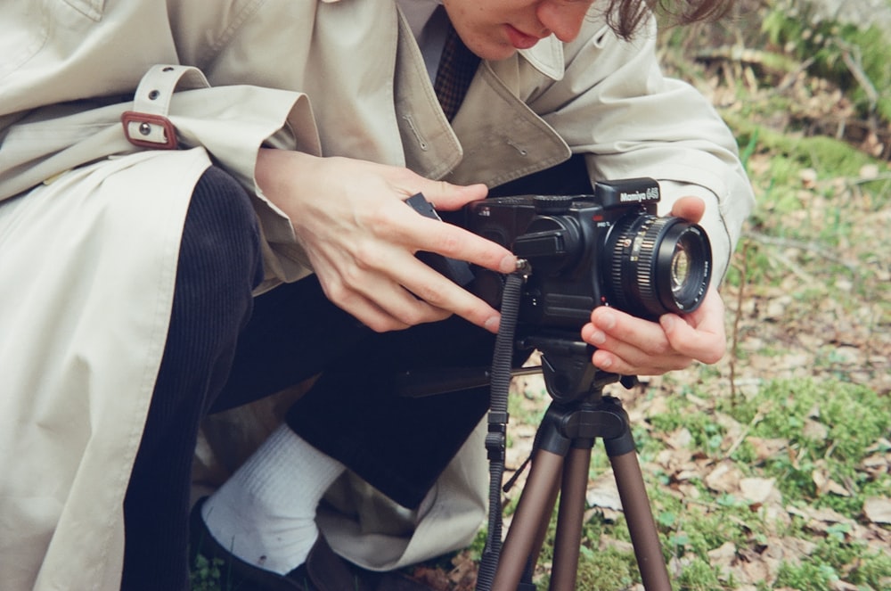 a woman is taking a picture with a camera