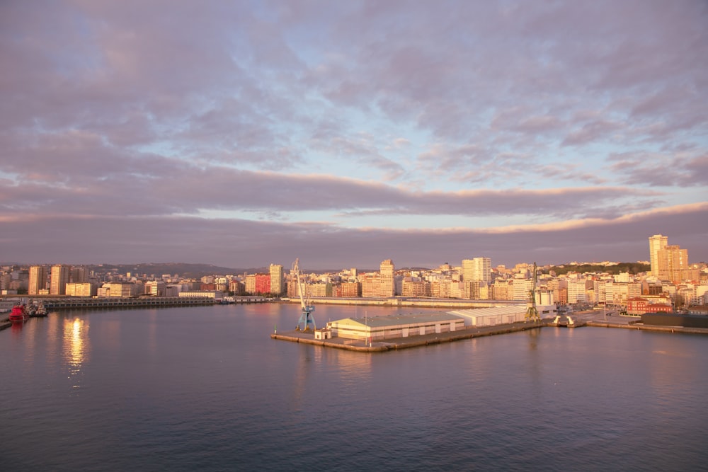 a body of water with a city in the background