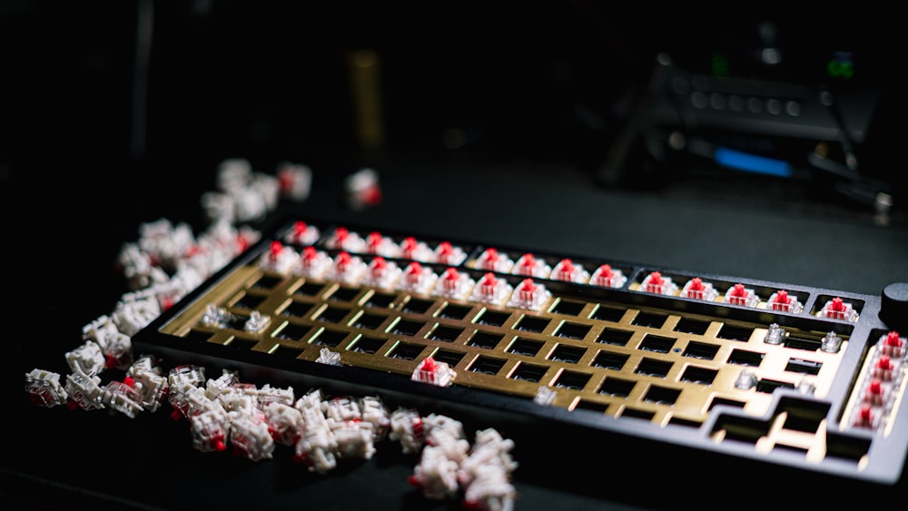 a computer keyboard covered in red and white dices
